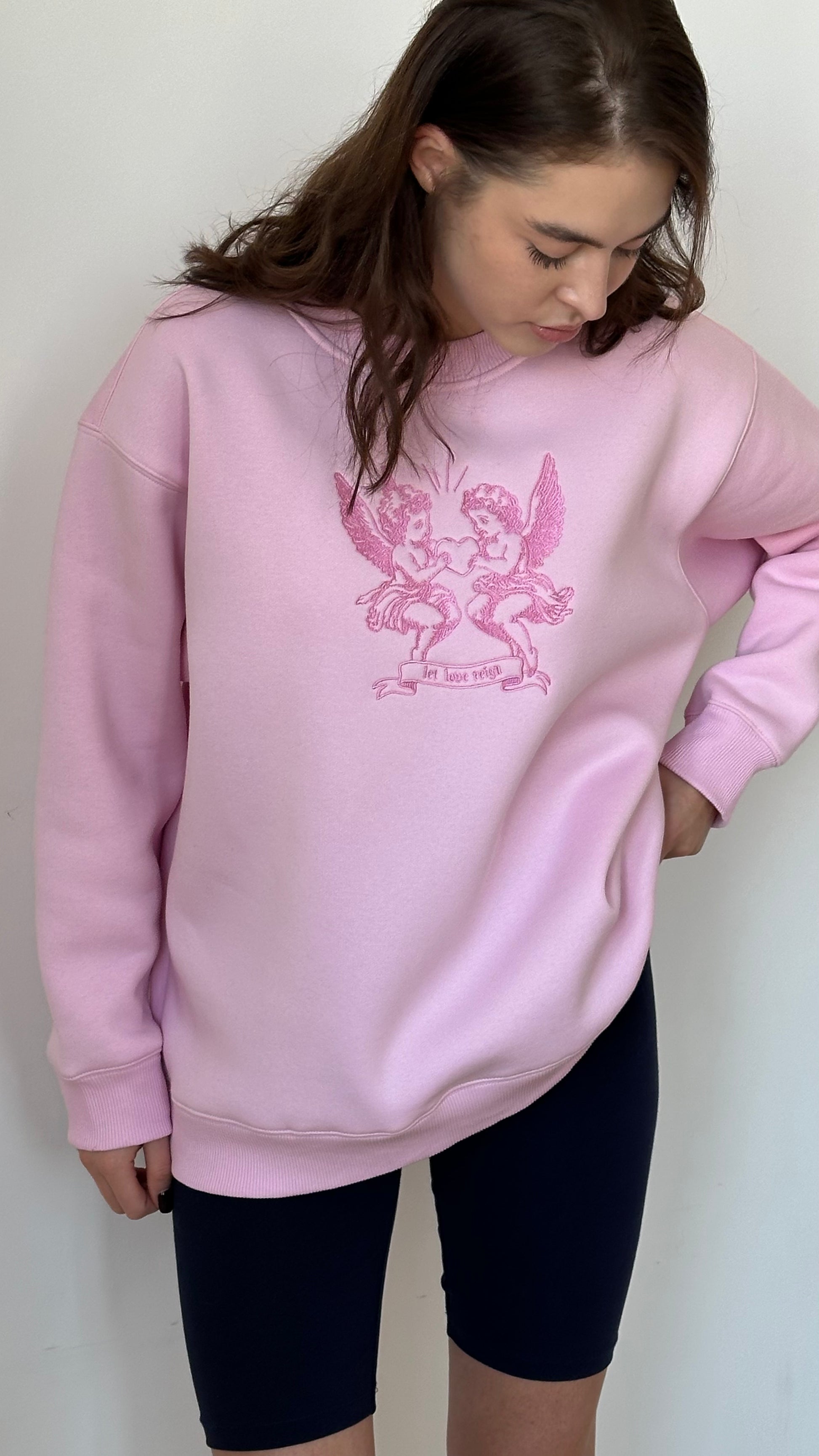 Світшот рожевий "Let love reign"